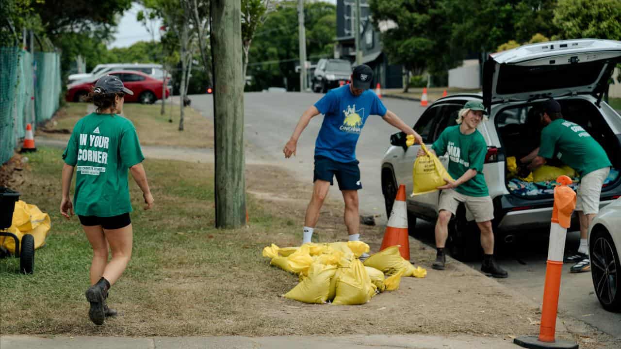 People sandbagging in preparation for Tropical Cyclone Alfred