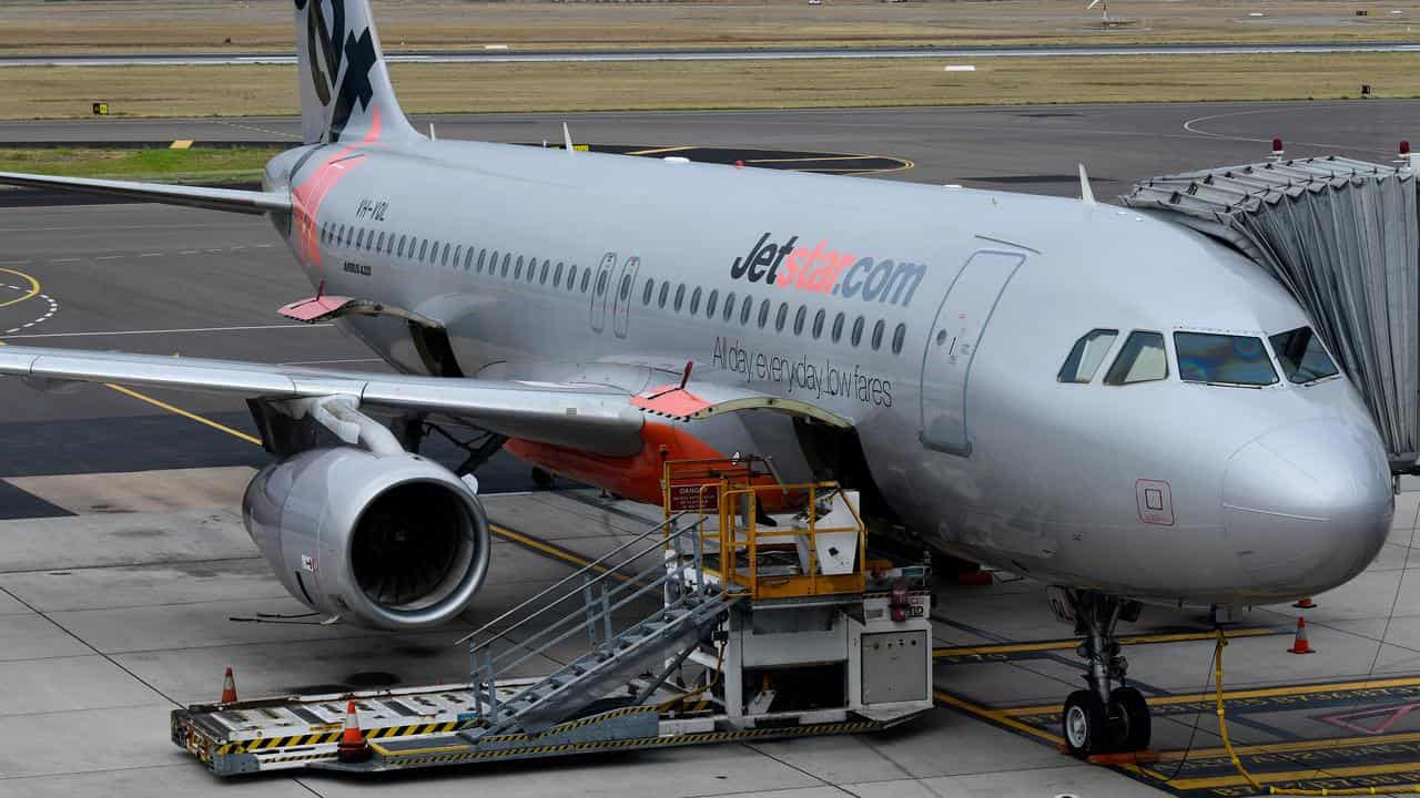 A Jetstar plane is seen on the tarmac