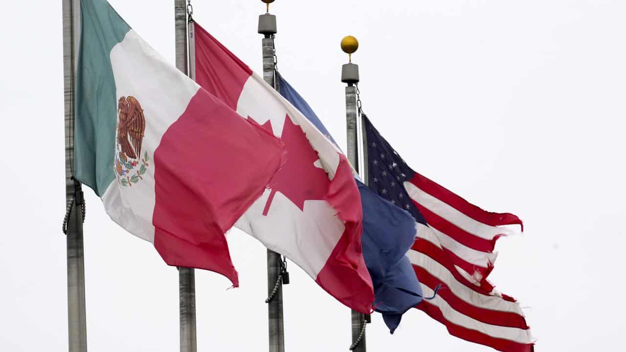 The flags of Mexico, Canada and the United States (file image)