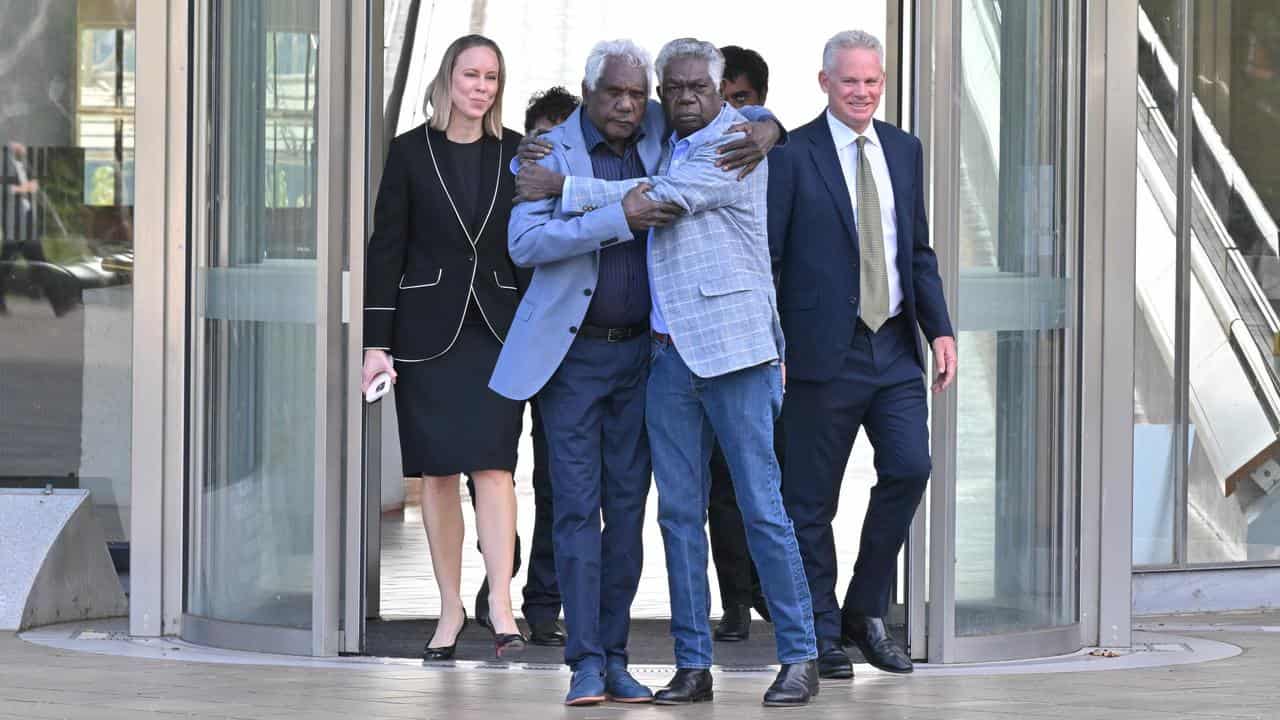 Gumatj leaders Balupalu Yunupingu and Djawa Yunupingu embrace