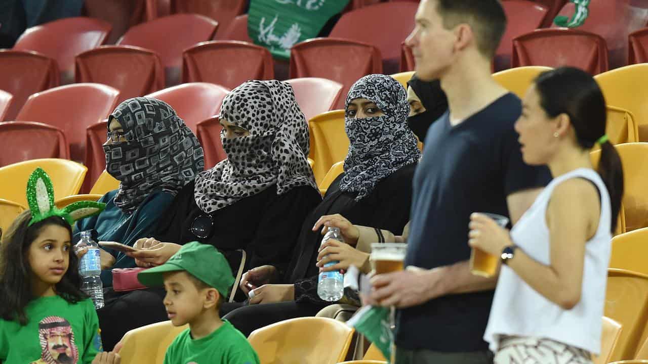 Women in niqabs attend a soccer match in Brisbane