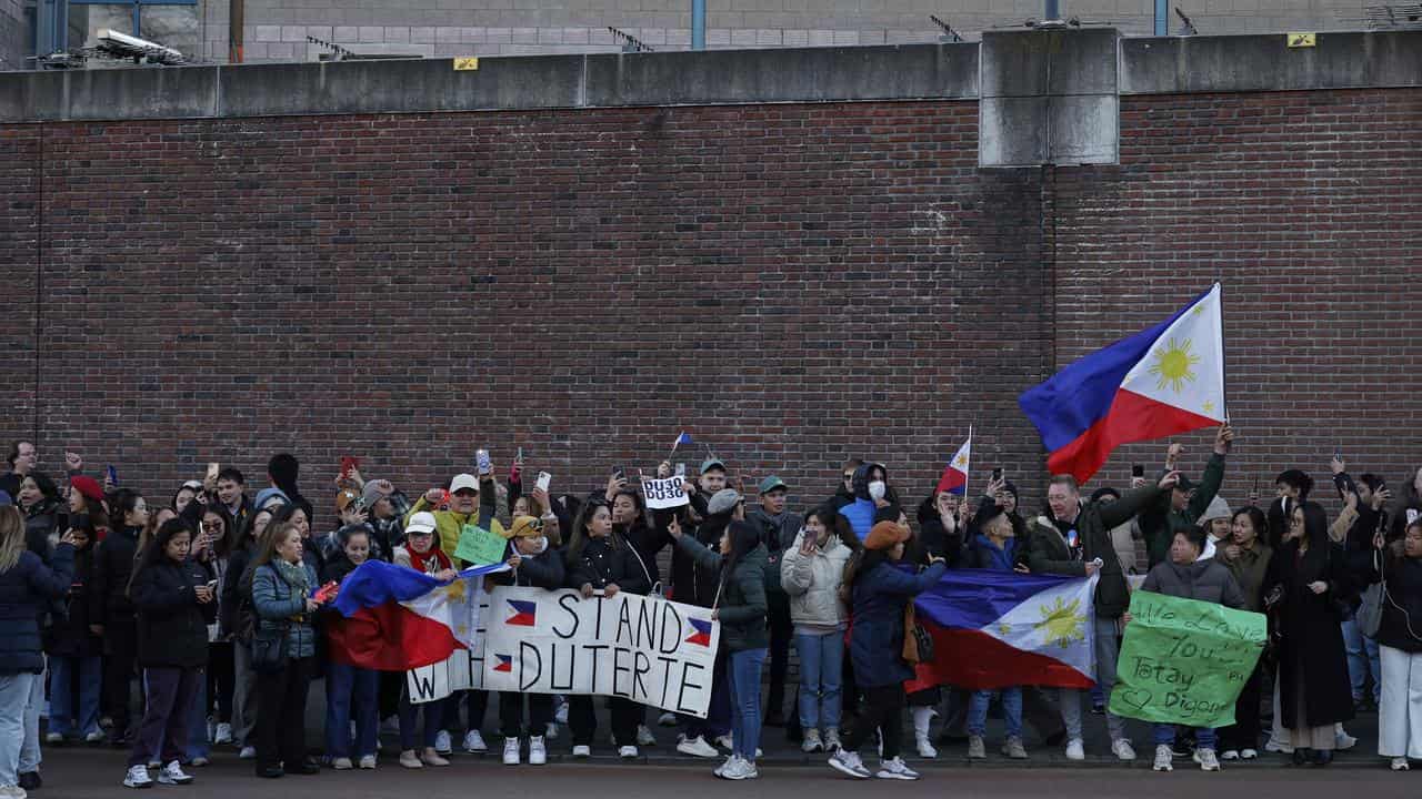 Supporters of Rodrigo Duterte protest outside the ICC detention centre