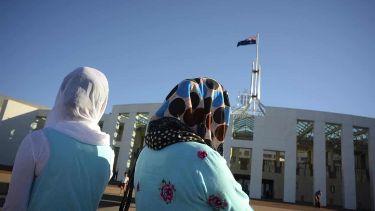 Women wearing hijabs outside parliament