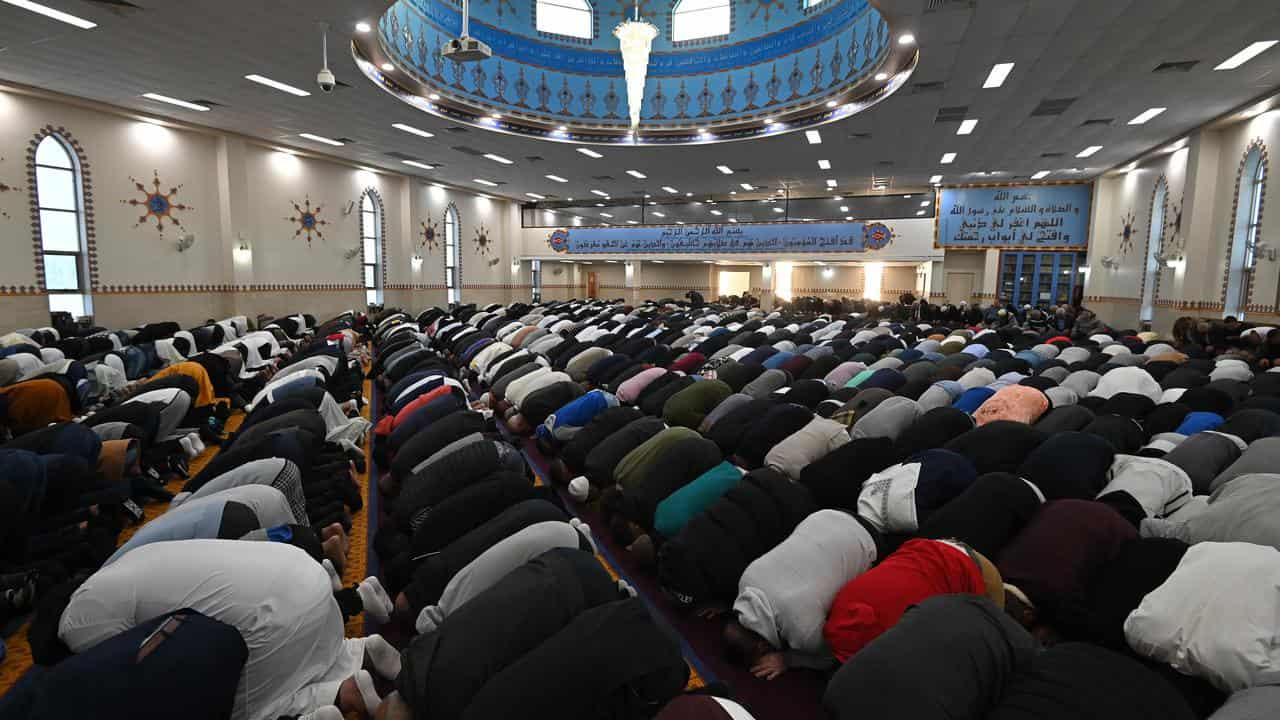 Worshippers participate in Eid al-Fitr prayers at the Lakemba Mosque