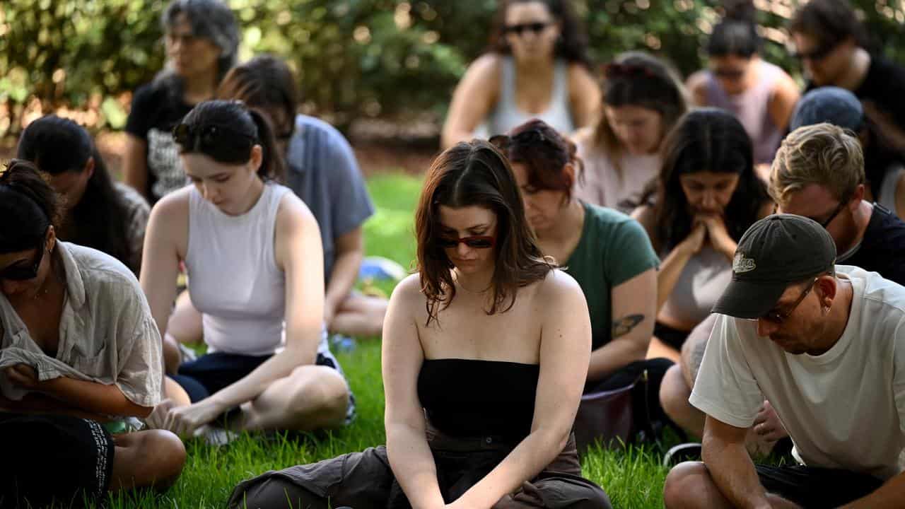 People attend a Stop Killing Women rally in Sydney