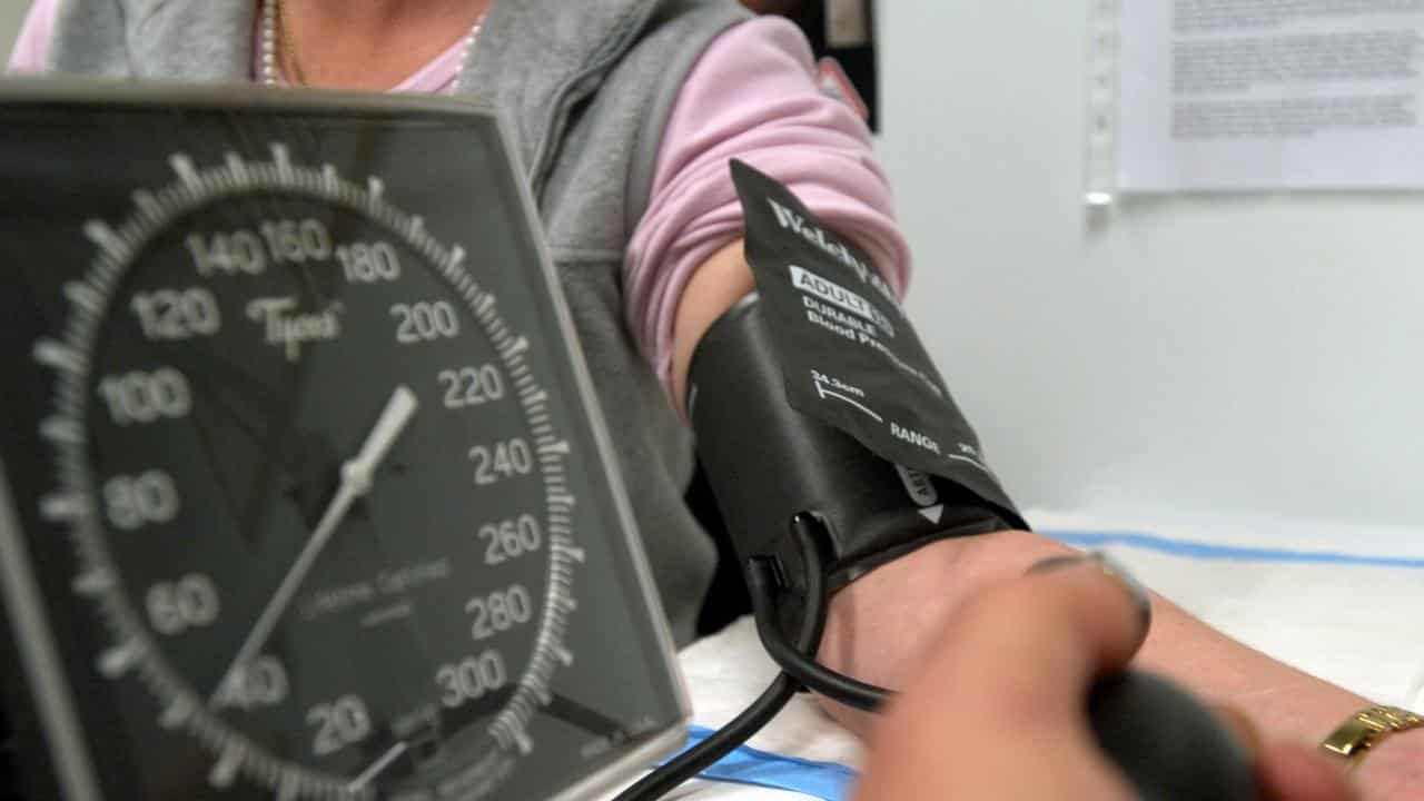 A patient has her blood pressure checked (file)