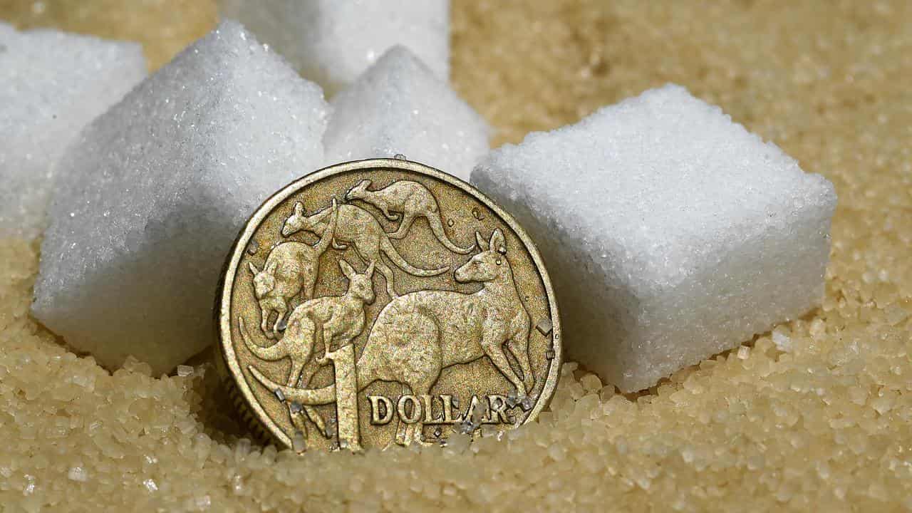 A dollar coin sitting among sugar cubes (file image)