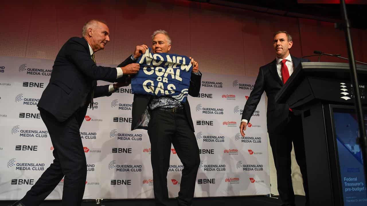 Protester interrupts Treasurer Jim Chalmers giving a speech