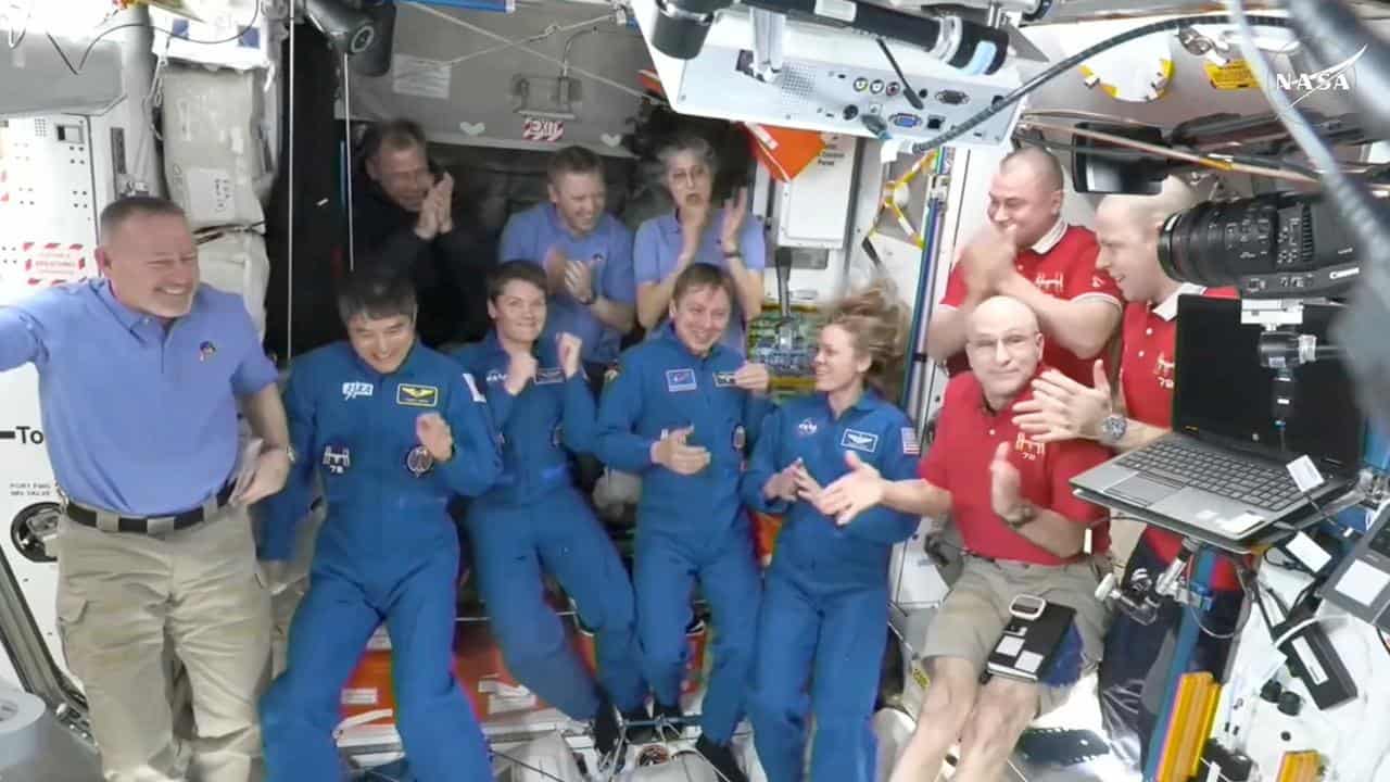 Astronauts greet each other on the ISS