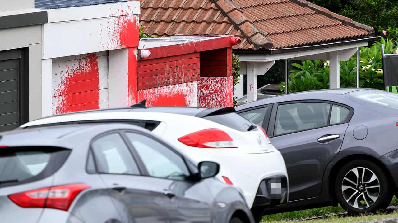 Red paint splashed on a home in Dover Heights