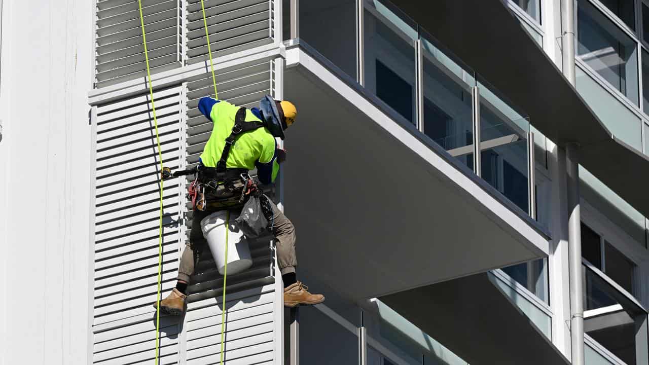 Rope access construction worker