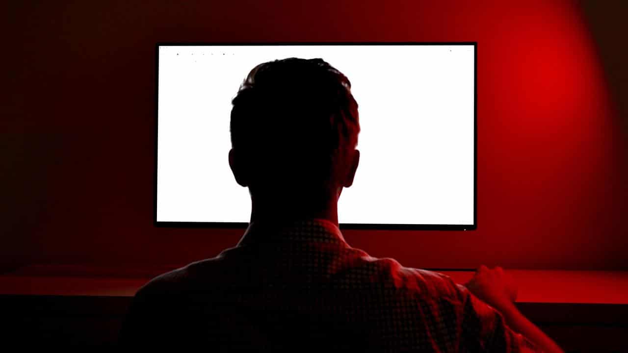 Man looks at screen