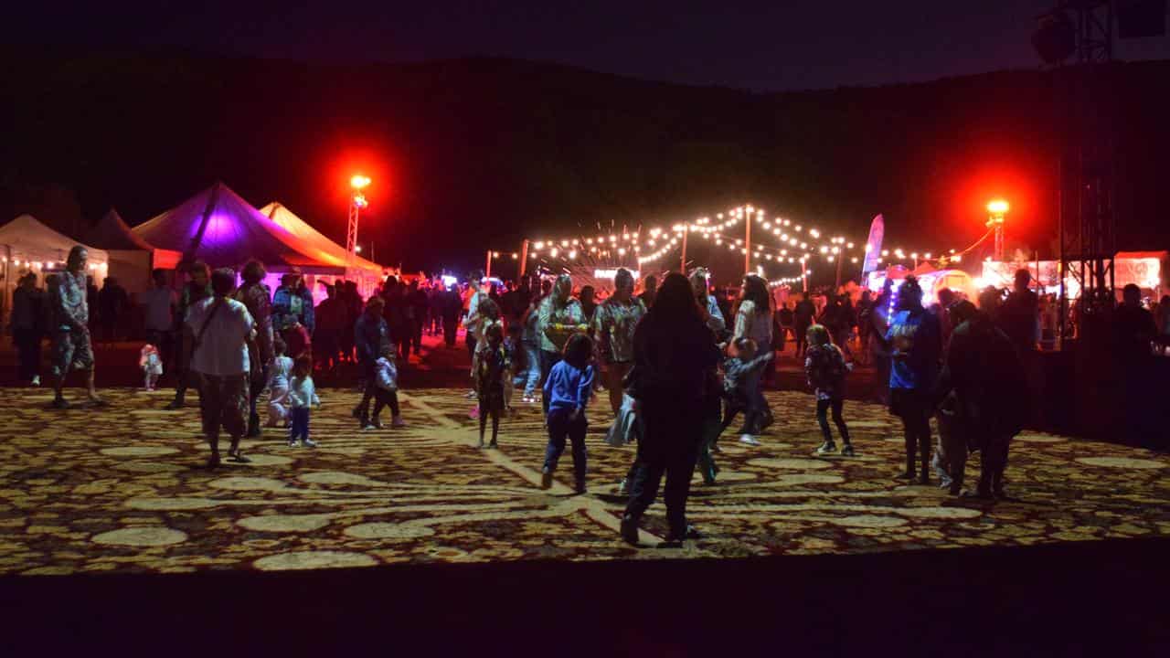 Families explore the 'Grounded' installation at the Parrtjima