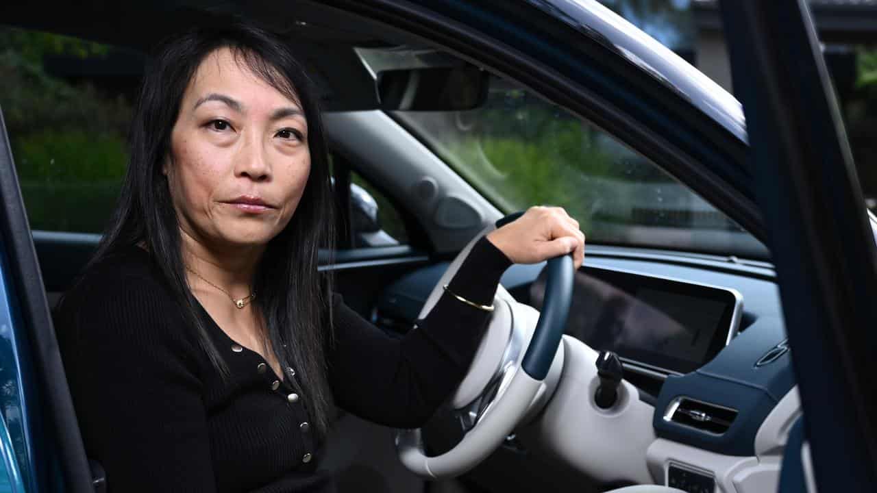 Michelle Bong with her EV in Melbourne