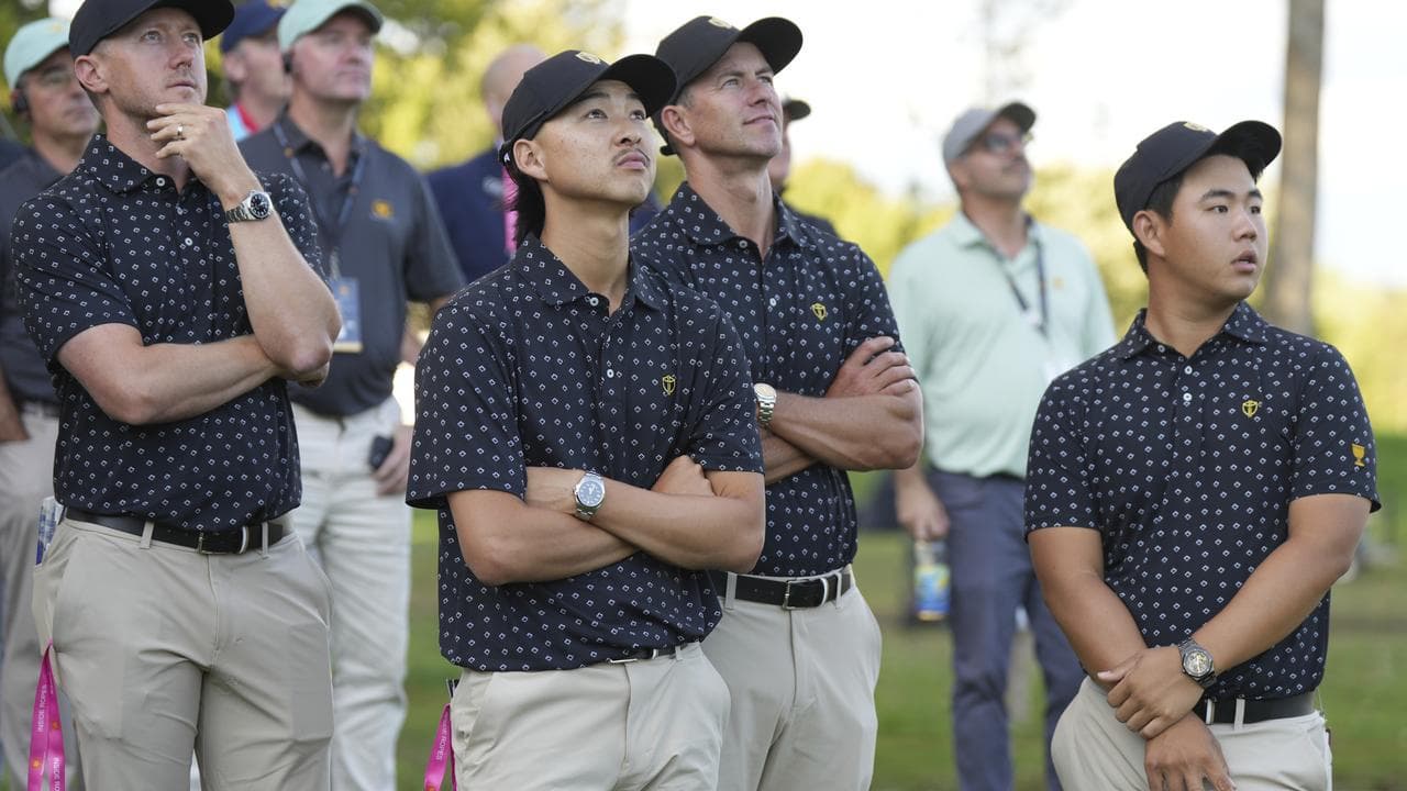 Adam Scott (seond right)