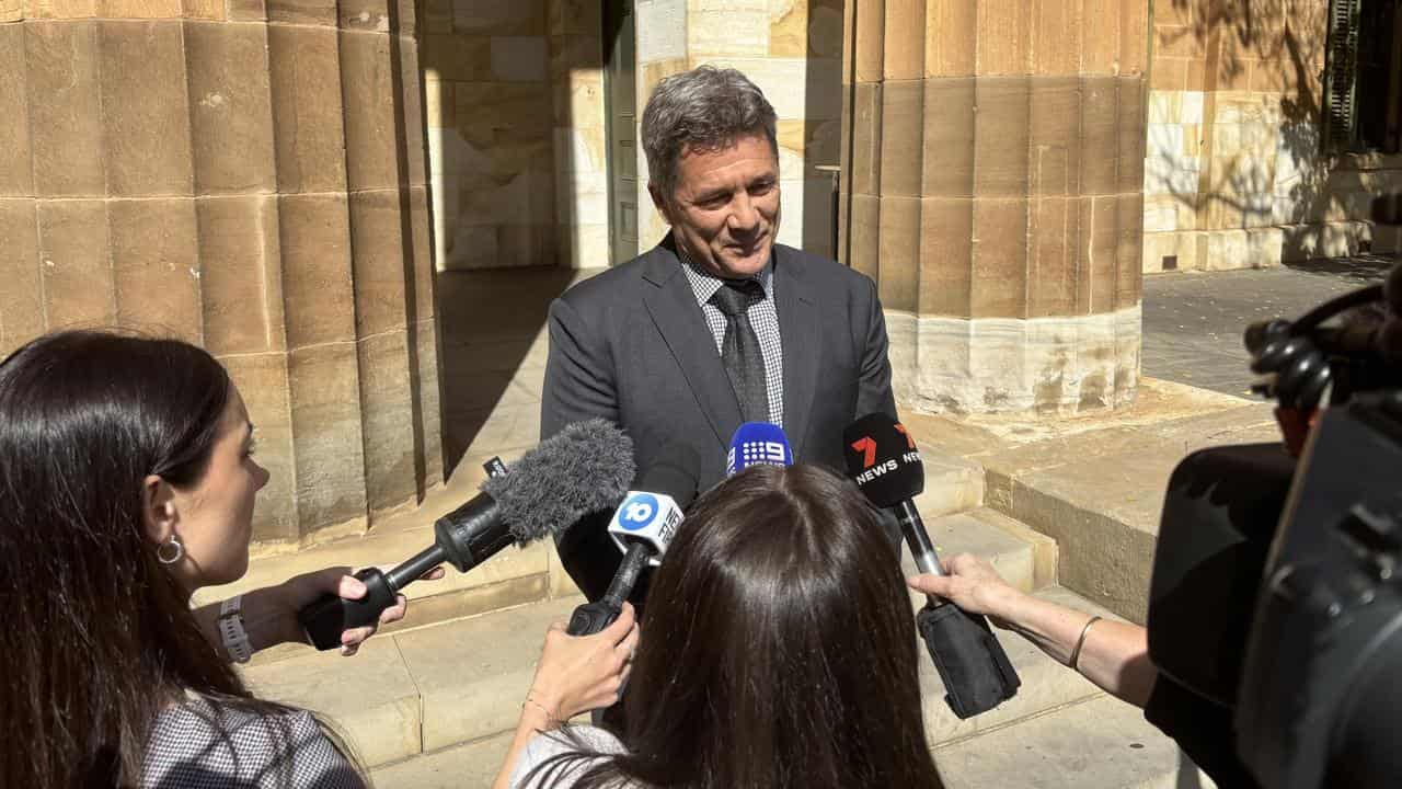 Lawyer Matthew Hopkins speaks to media