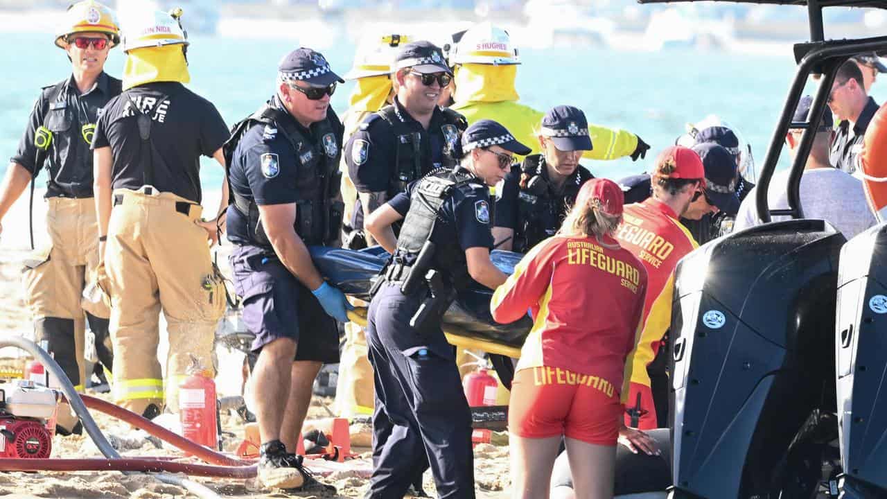 Emergency workers at the scene of the 2023 helicopter collision