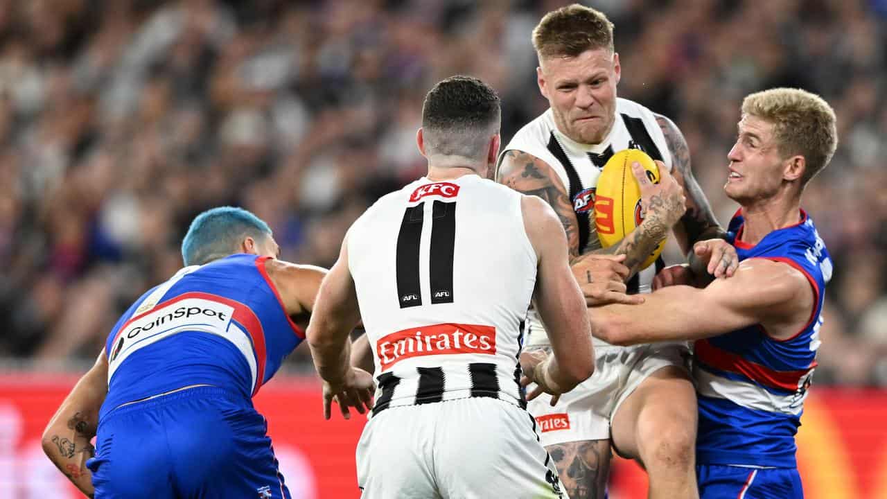 Jordan De Goey (second right) returns for the Magpies.