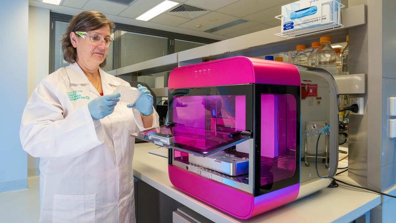 A researcher using a Rastrum 3D cell printer (file image)
