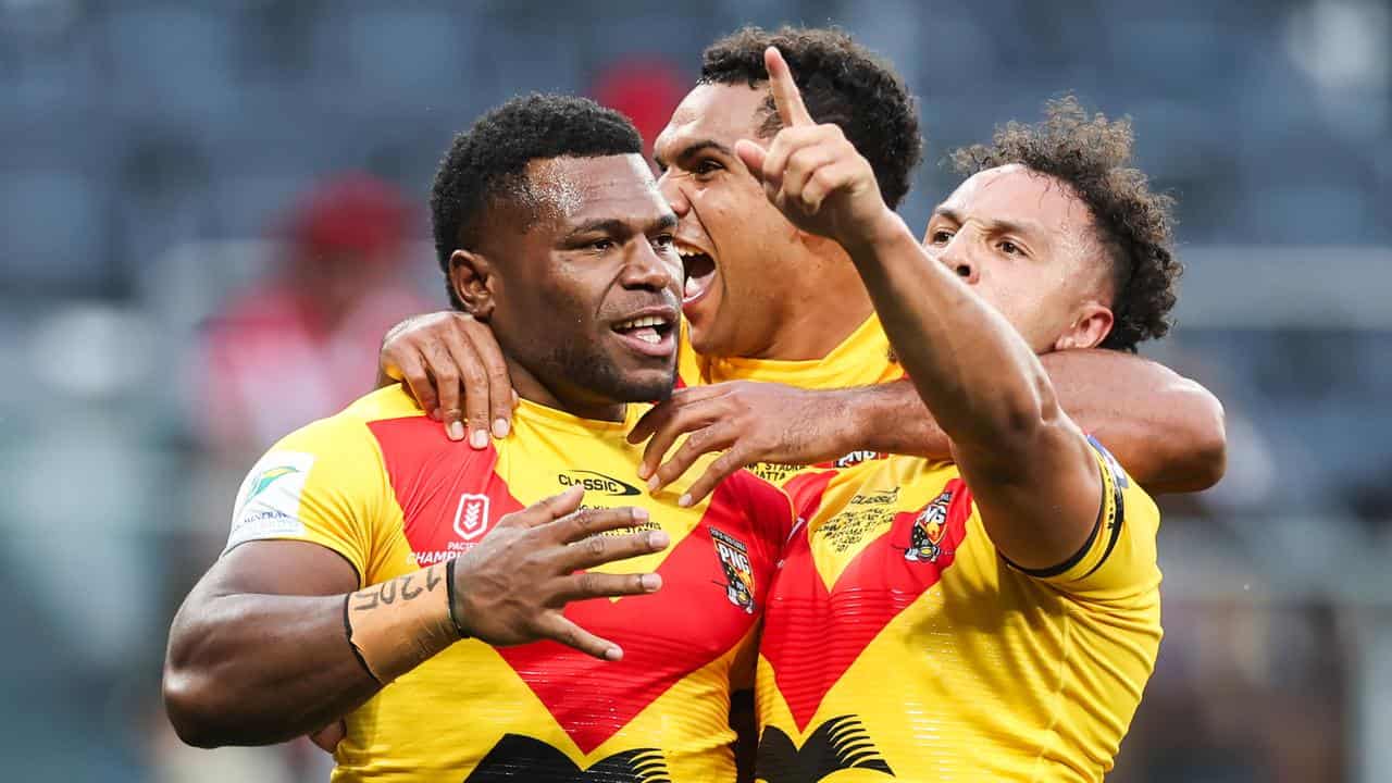 Sylvester Namo of the PNG Kumuls celebrates scoring a try