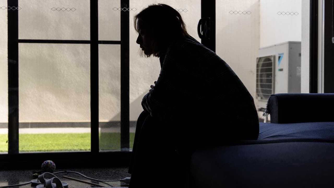 A woman looking downcast