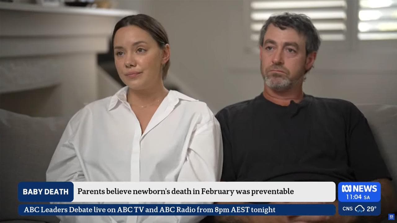 A screenshot from an ABC video with the parents of Harper Atkinson