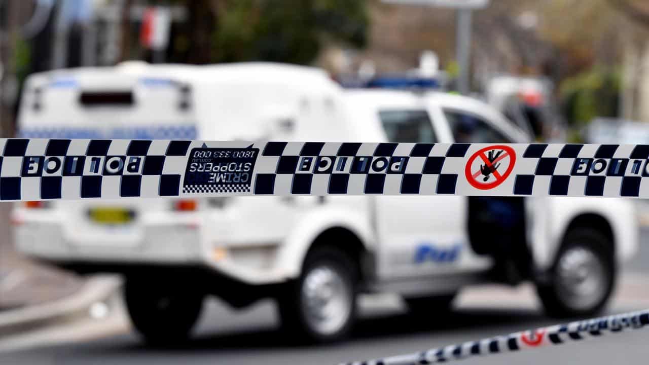 Police tape restricts access to a street (file image)