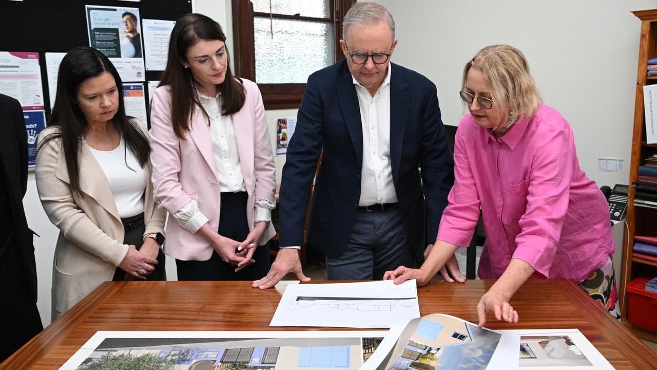 Anthony Albanese looks at architectural plans