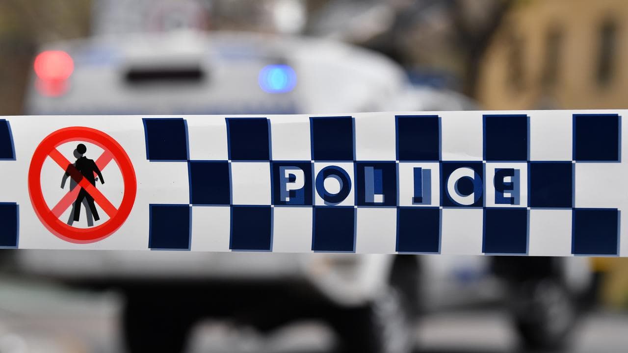 Police tape restricts access to a street (file image)
