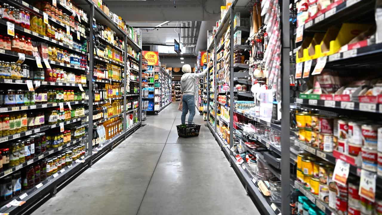 A woman shopping at a supermarket