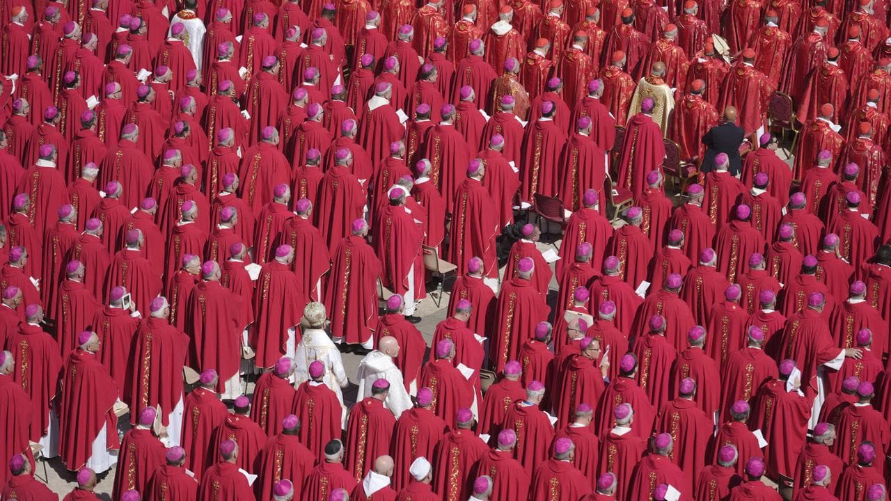 Clergy stand during the funeral of Pope Francis in St Peter's Square