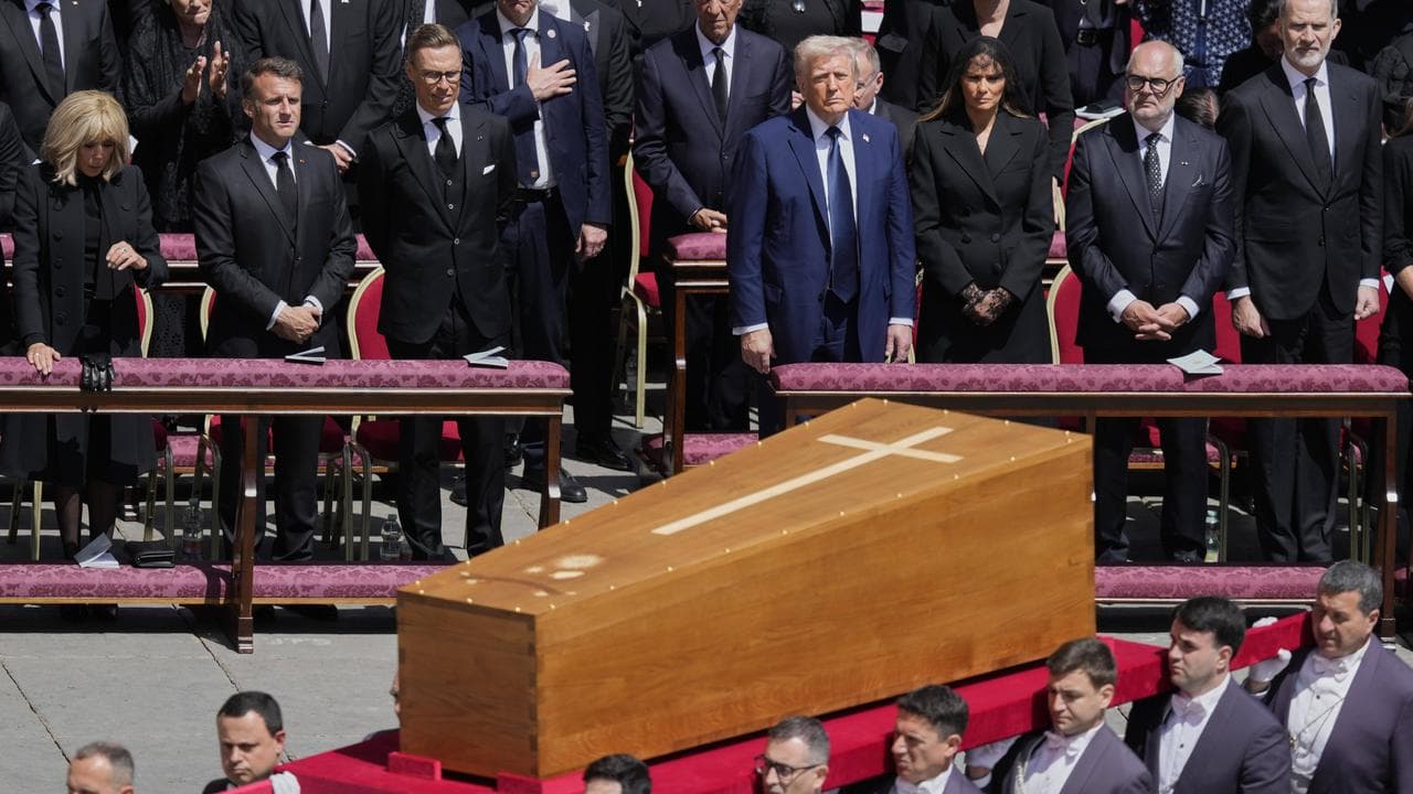 The coffin of Pope Francis is carried in front of dignitaries