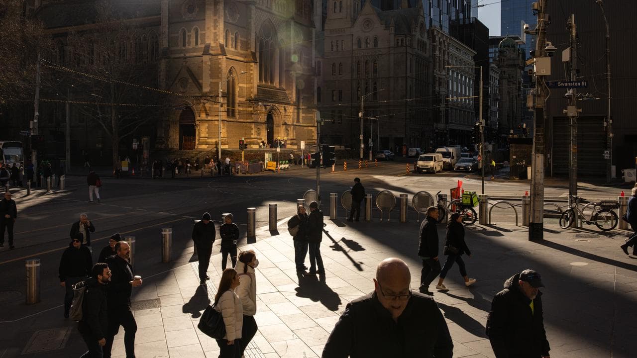 People are seen during a cold morning in Melbourne