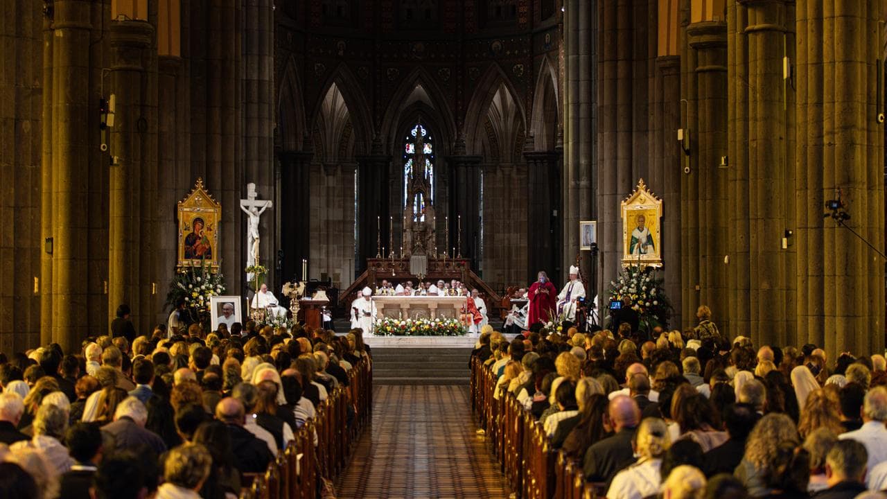 Worshippers attend a mass