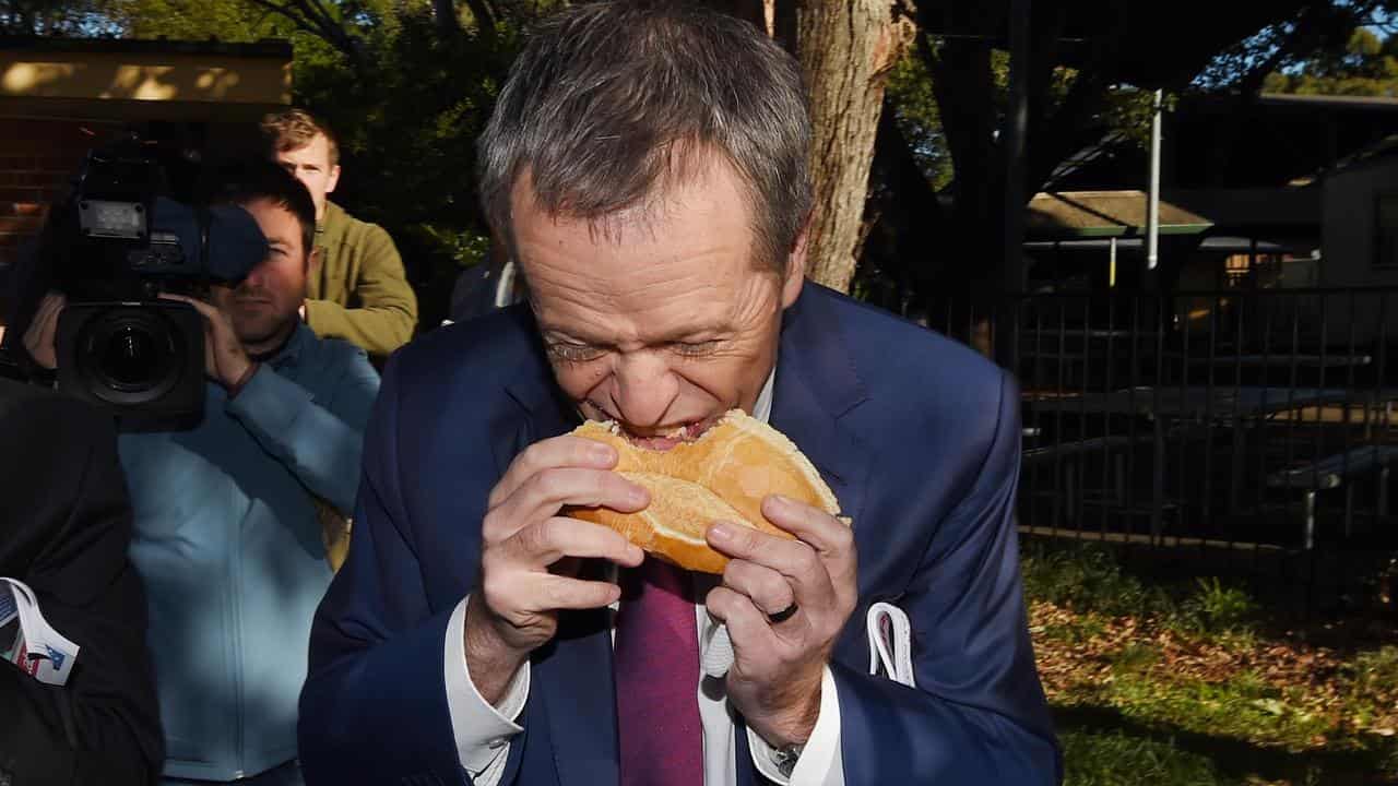 Then opposition leader Bill Shorten eating a sausage sideways