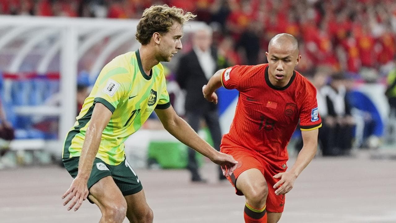 Australia's Ryan Teague, left keeps