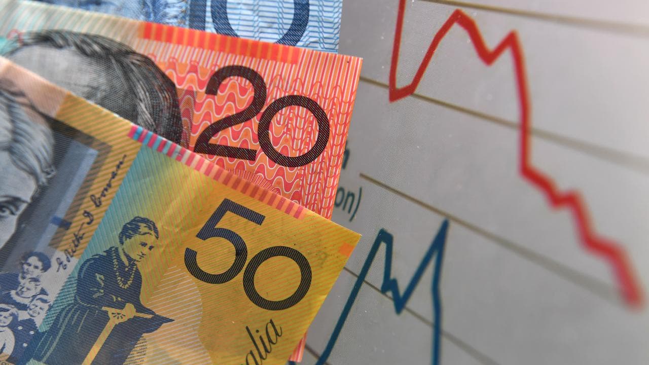 Australian currency is seen next to a wages graph