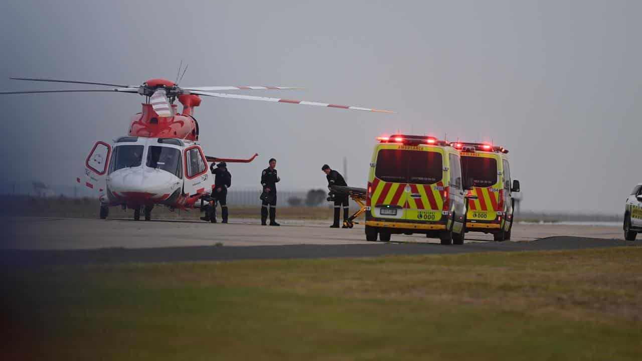 Ambulances including a helicopter attend a crash at Avalon Airshow