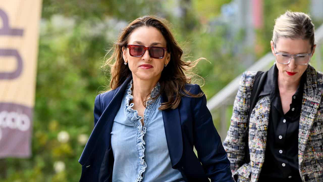 Peggy Dwyer SC (left) arrives at the Lidcombe Coroners Court