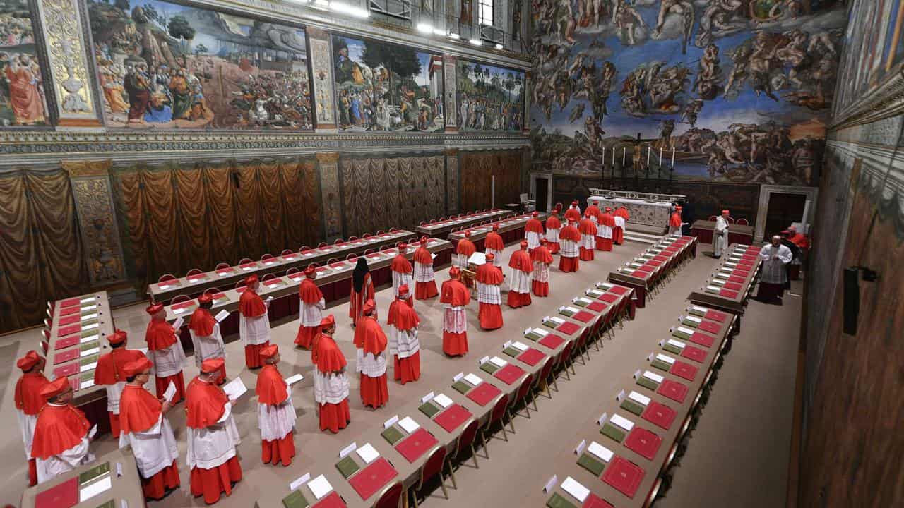Cardinals attend the first day of the conclave in the Sistine Chapel