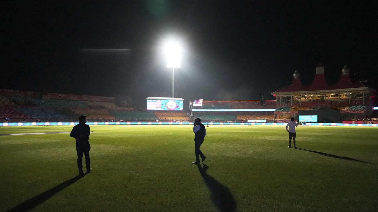 Officials walk on the playing field