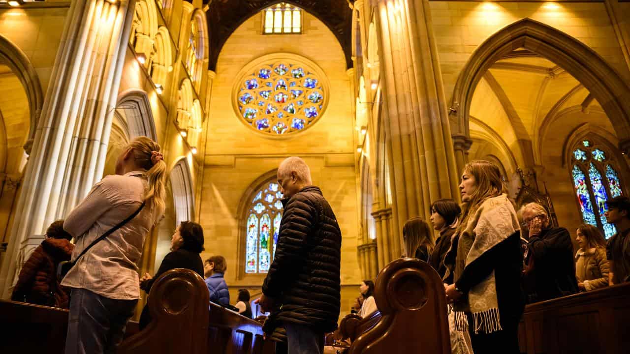 People pray at St Mary's Cathedral in Sydney