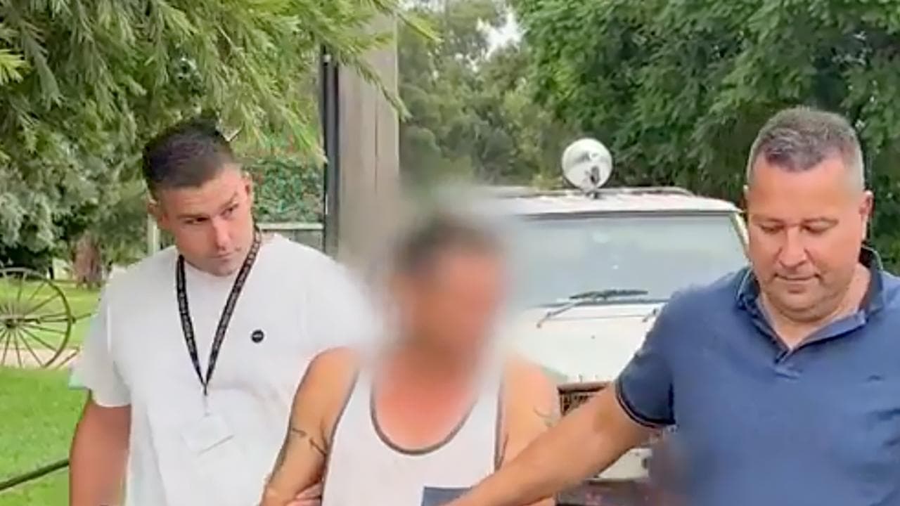 Clinton Wrigley beiing arrested (file)