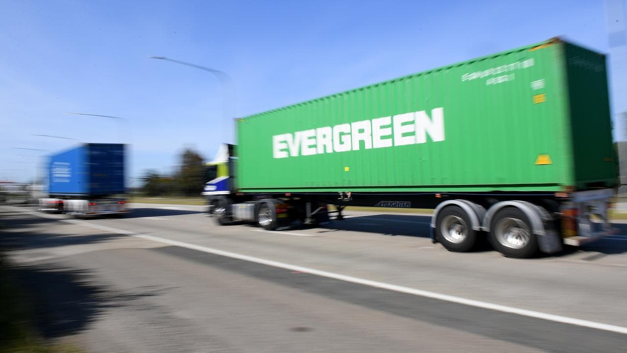Trucks carrying shipping containers (file image)