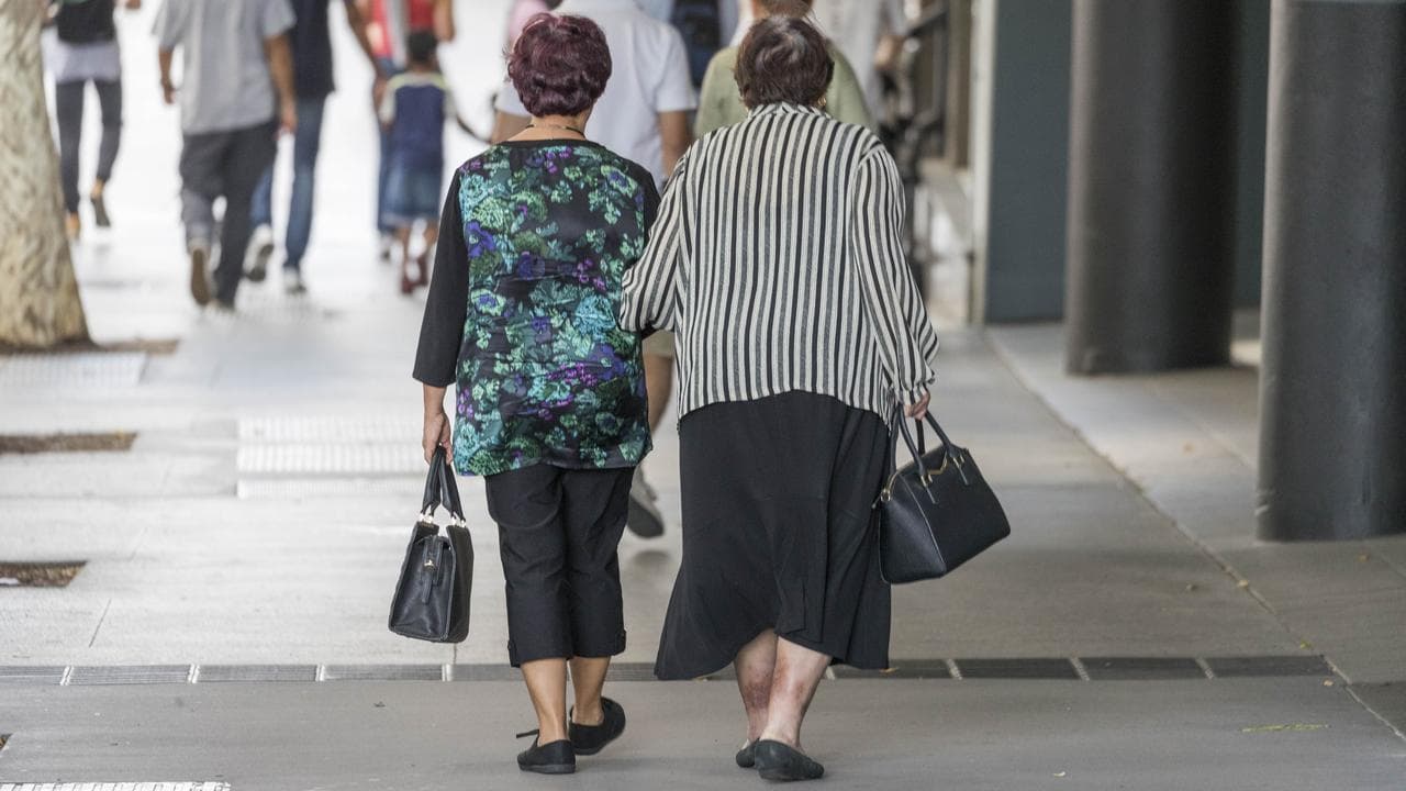 Older ladies walking in the street