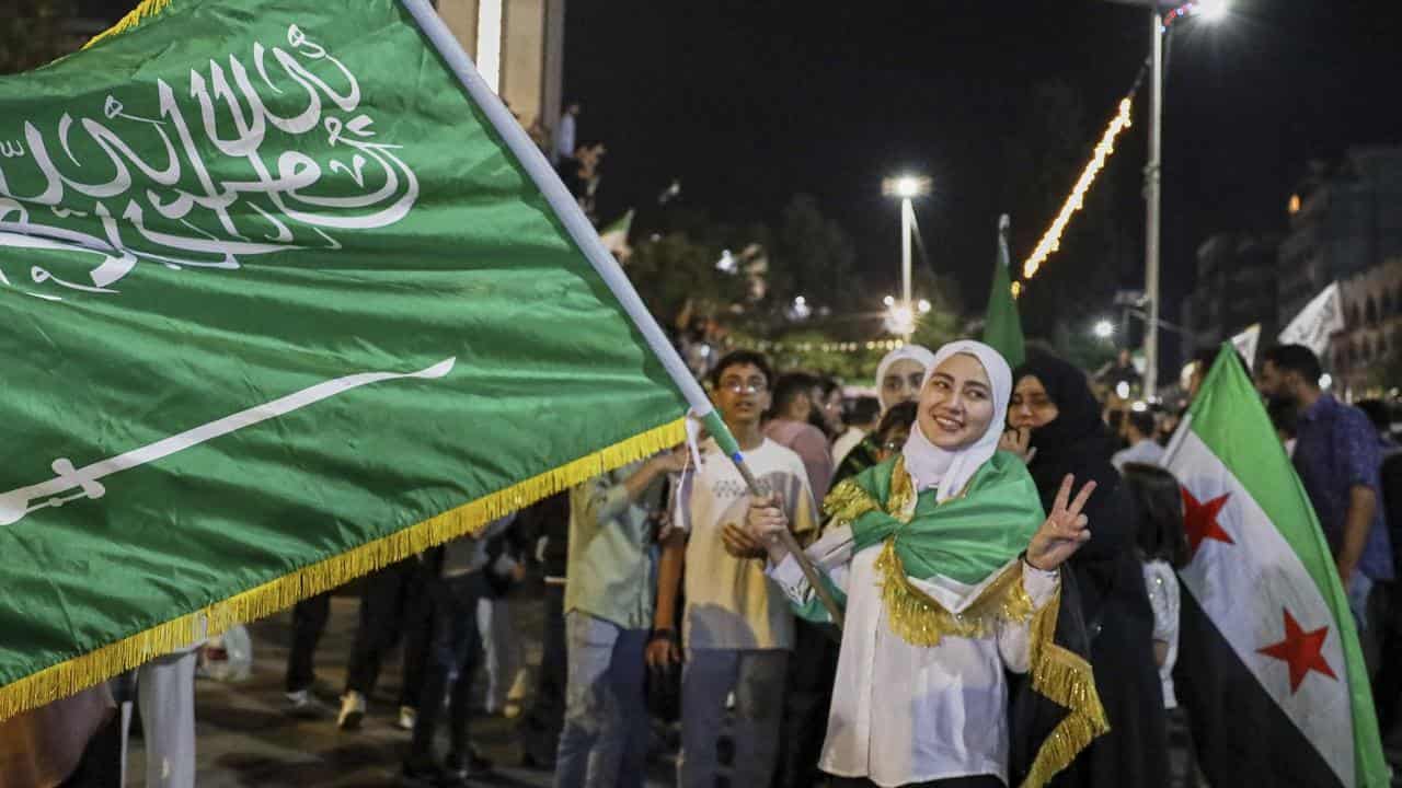 People in Homs, Syria, celebrate the easing of US sanctions
