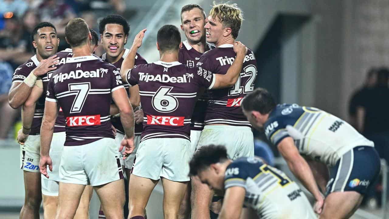 Sea Eagles players celebrate Lehi Hopoate's try
