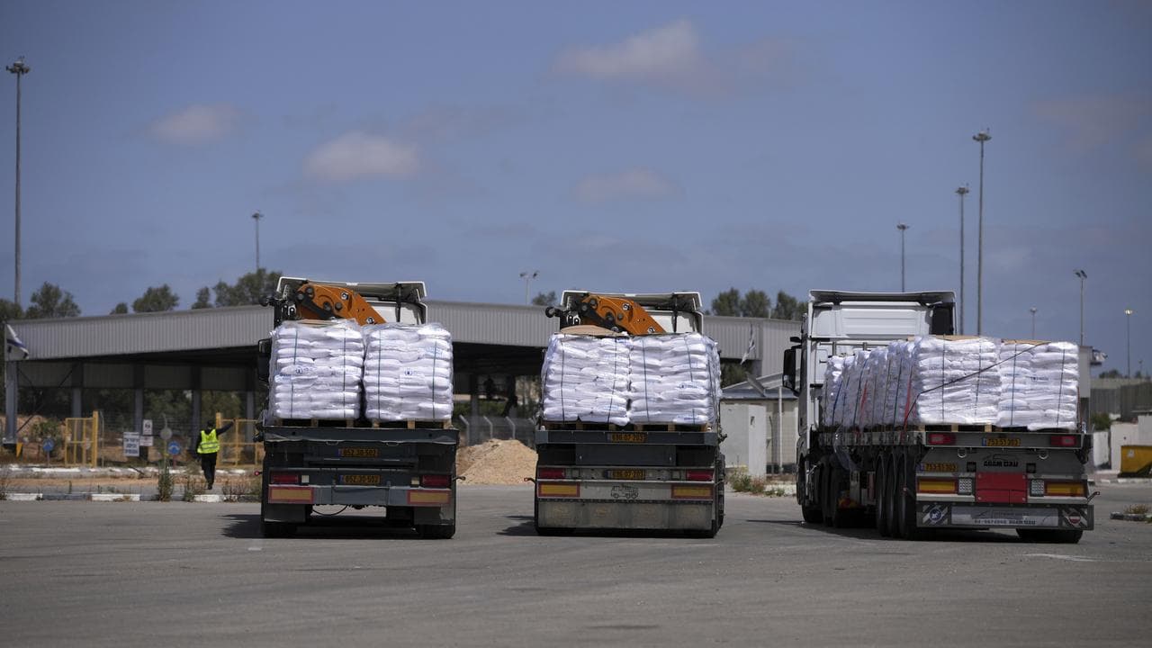Trucks carrying humanitarian aid at the Kerem Shalom Crossing, Israel