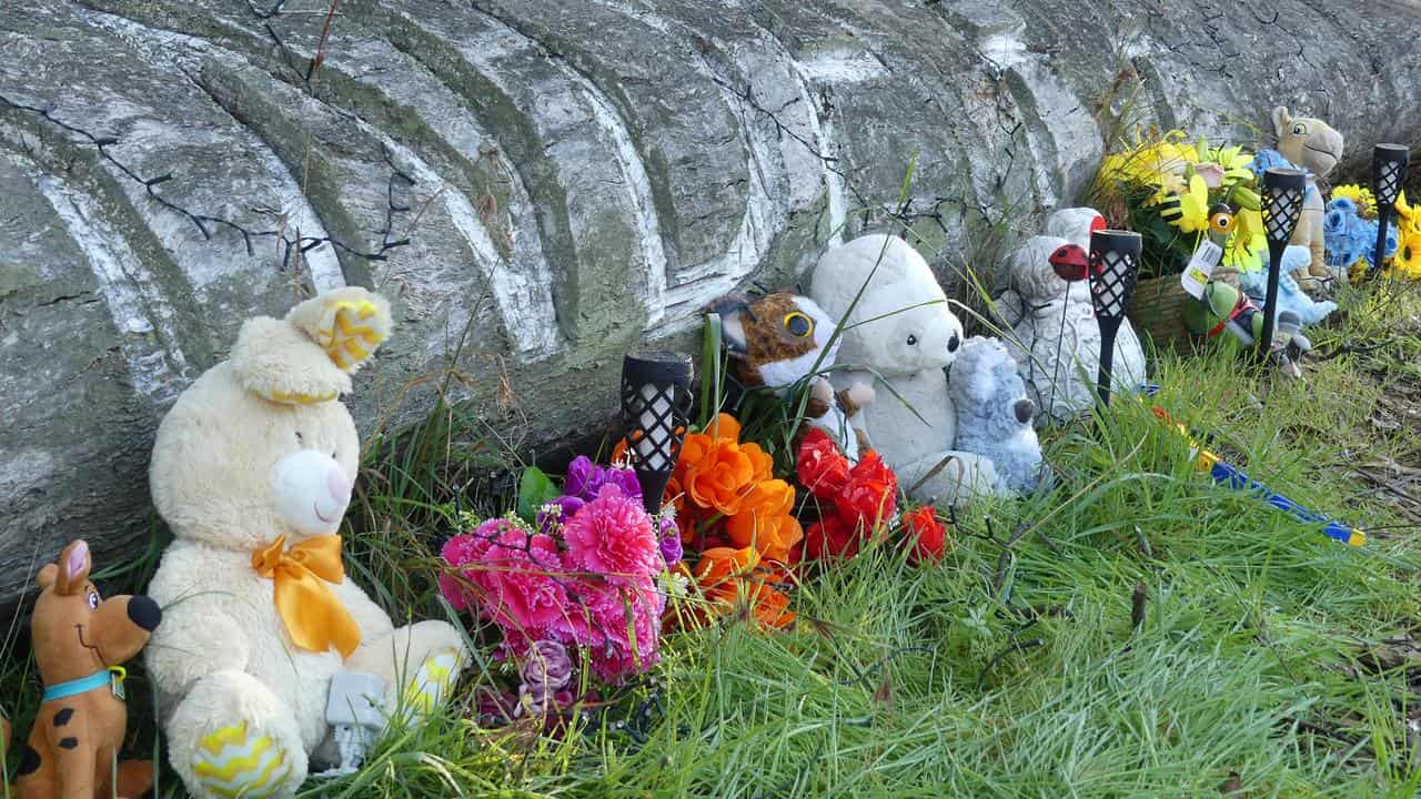 Tributes near a house where two young boys were found (file)