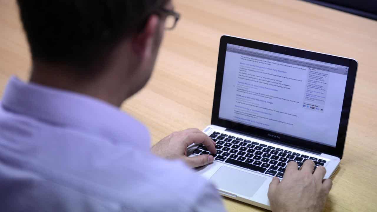 Man uses laptop computer